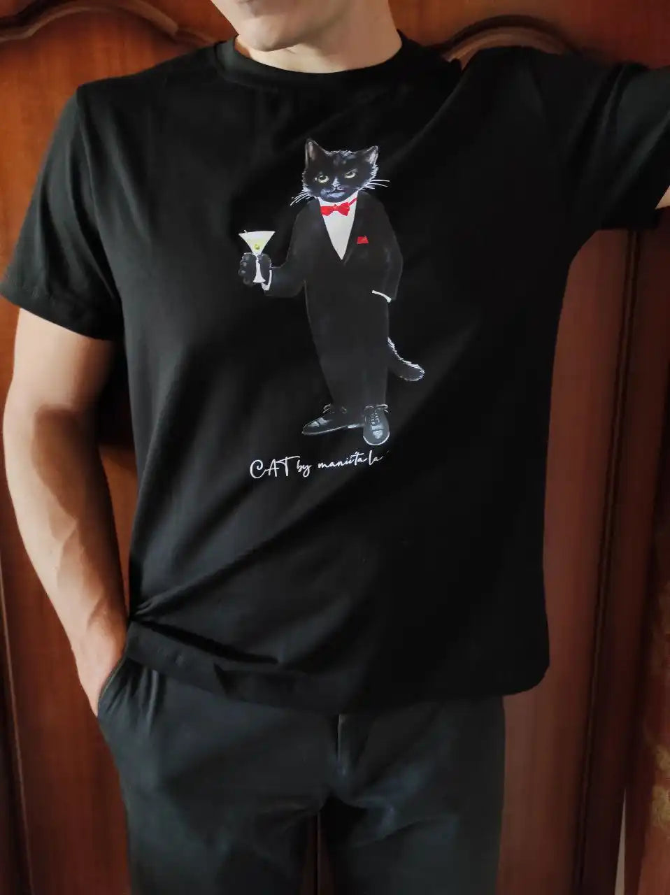 Black t-shirt with cat graphic.