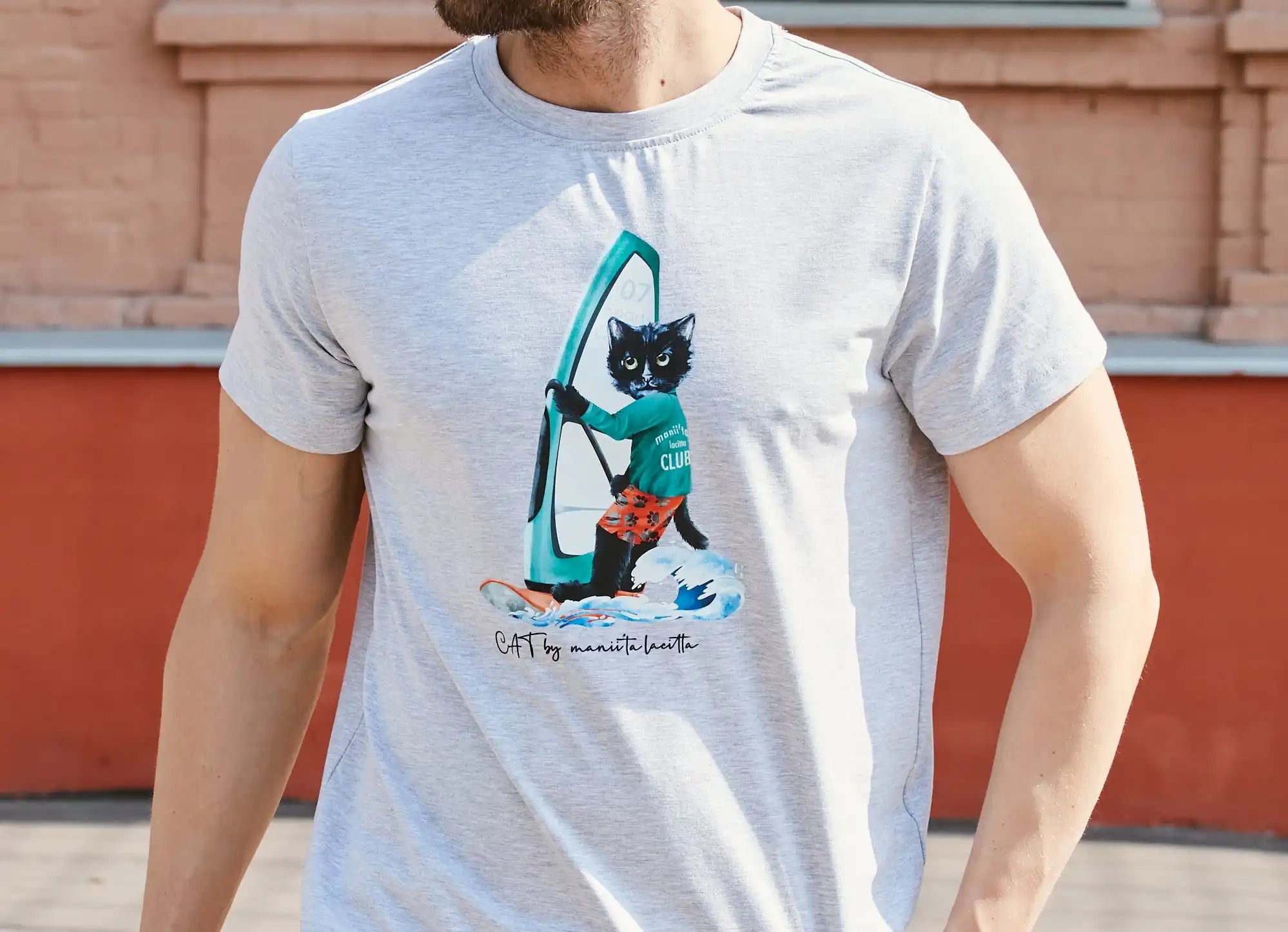 Gray t-shirt with cat surfing graphic.