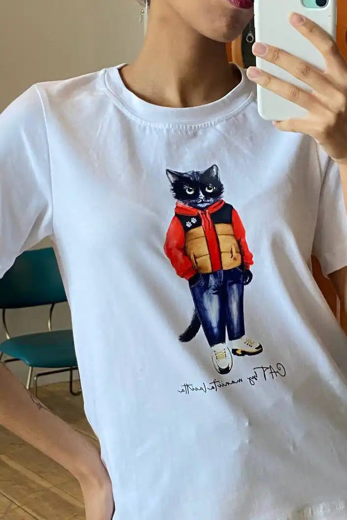 White t-shirt with cat graphic.